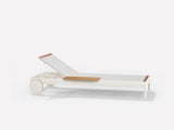 Sunlounger with castors and small table on the right